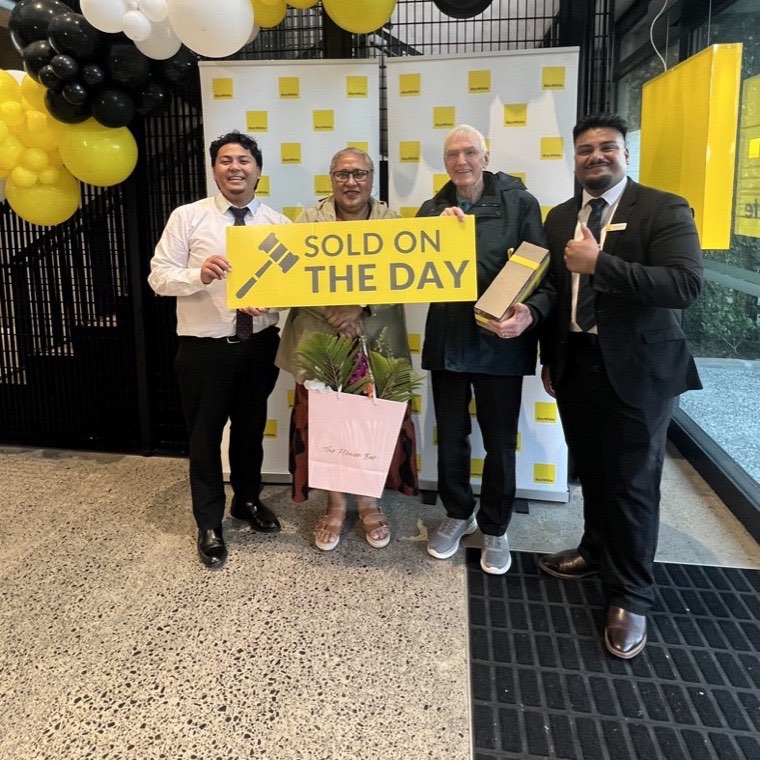 Sellers celebrating their sale at Ray White Manukau