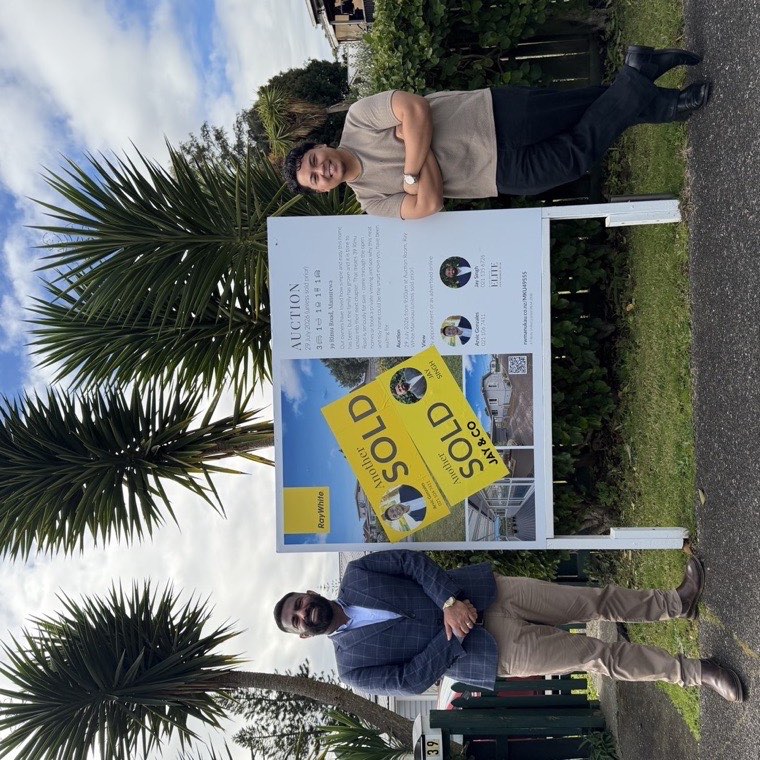 Arvic and Jay Singh beside a sold sign at 39 Rimu Road, Manurewa
